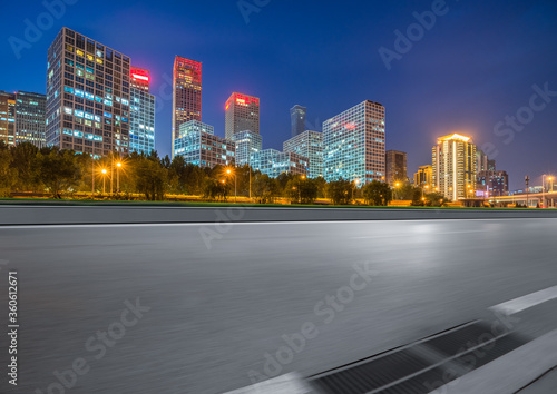 Asphalt highway and modern business district office buildings in Beijing at night  China