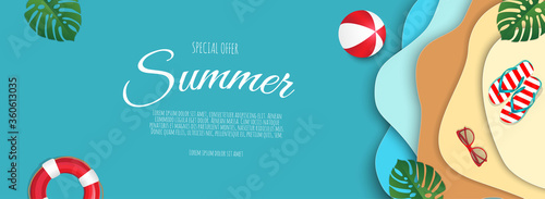 Top view beach background with balls, swim ring, sunglasses, sandals and sea.