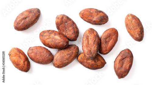 dried unpeeled cocoa beans isolated on white background, top view