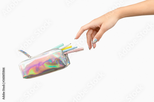 Womans hand and office supplies stationery levitate over white background photo