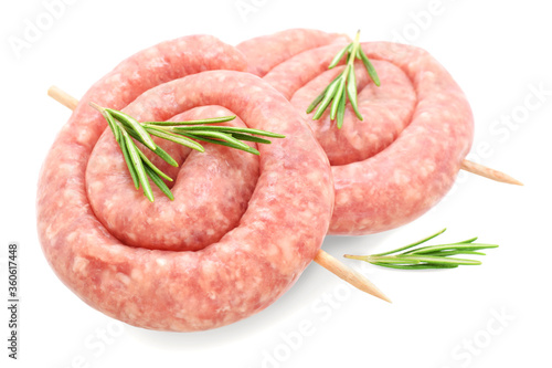 Sausage curled to barbecue with fresh rosemary plant isolated on white