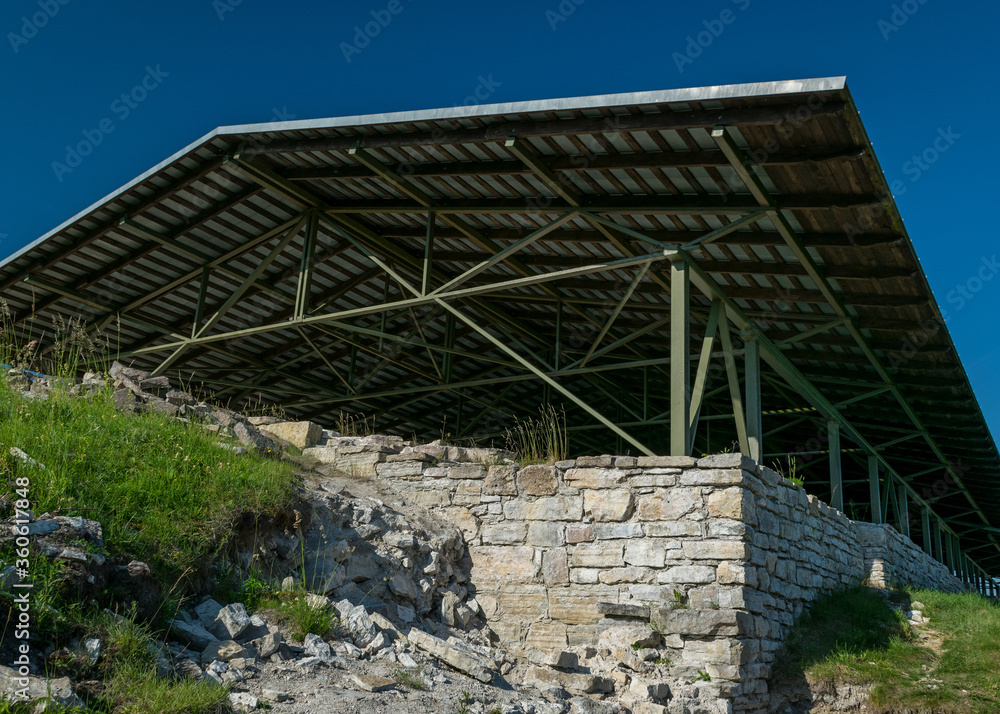 old stone ruins, roof placed to prevent death, sunny summer day