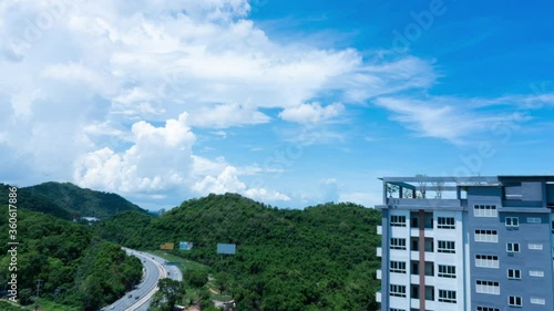Wallpaper Mural Time lapse beautiful blue sky with clouds flow through hill road and building architecture. Torontodigital.ca