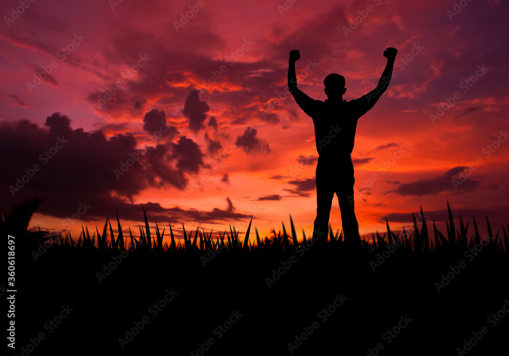 silhouette the strong man with beautiful sky background