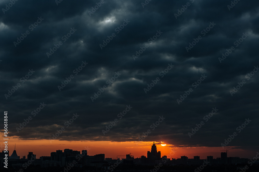 The absorption of the city in a dark sunset
