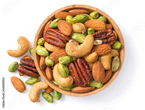 unsalted mixed nuts in the wooden bowl, isolated on white background, top view photo