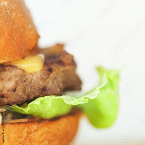 Piece of homemade burger isolated on white background, side view