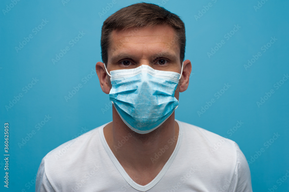 Portrait of man wearing an anti virus protection mask to prevent corona virus. Portrait of man wearing an anti virus protection mask to prevent corona virus.
