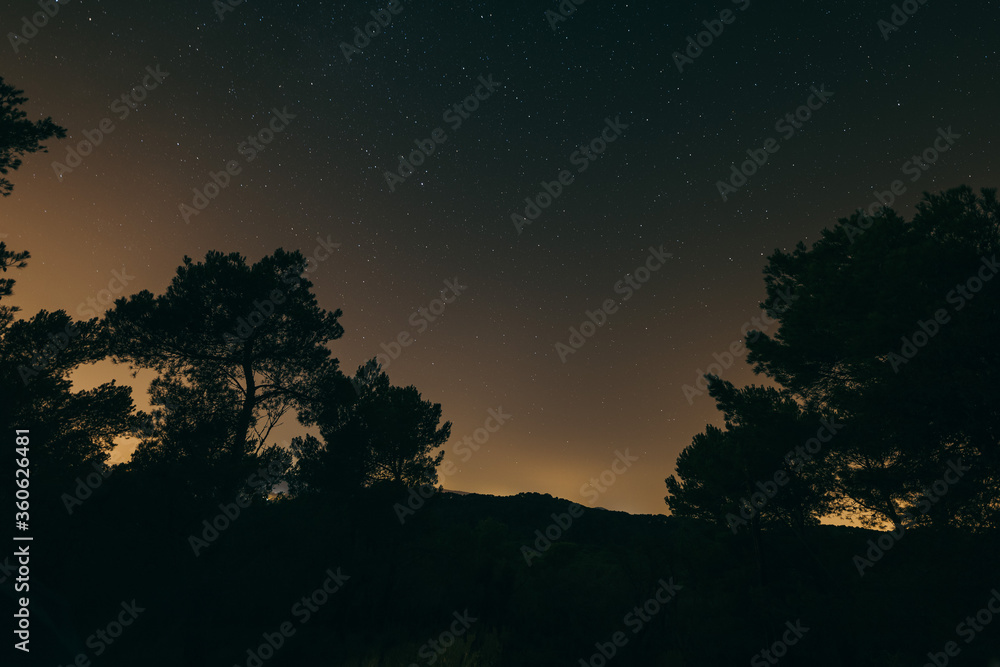 A sign in front of a sunset