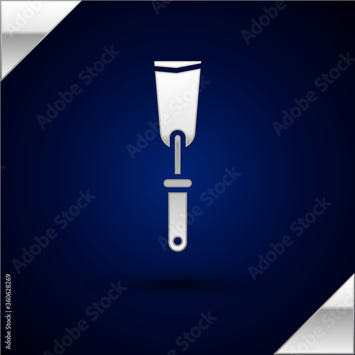 Silver Putty knife icon isolated on dark blue background. Spatula repair tool. Spackling or paint instruments. Vector Illustration.