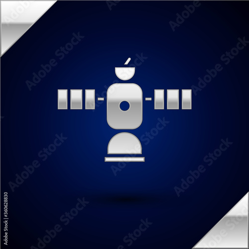 Silver Satellite icon isolated on dark blue background. Vector Illustration.