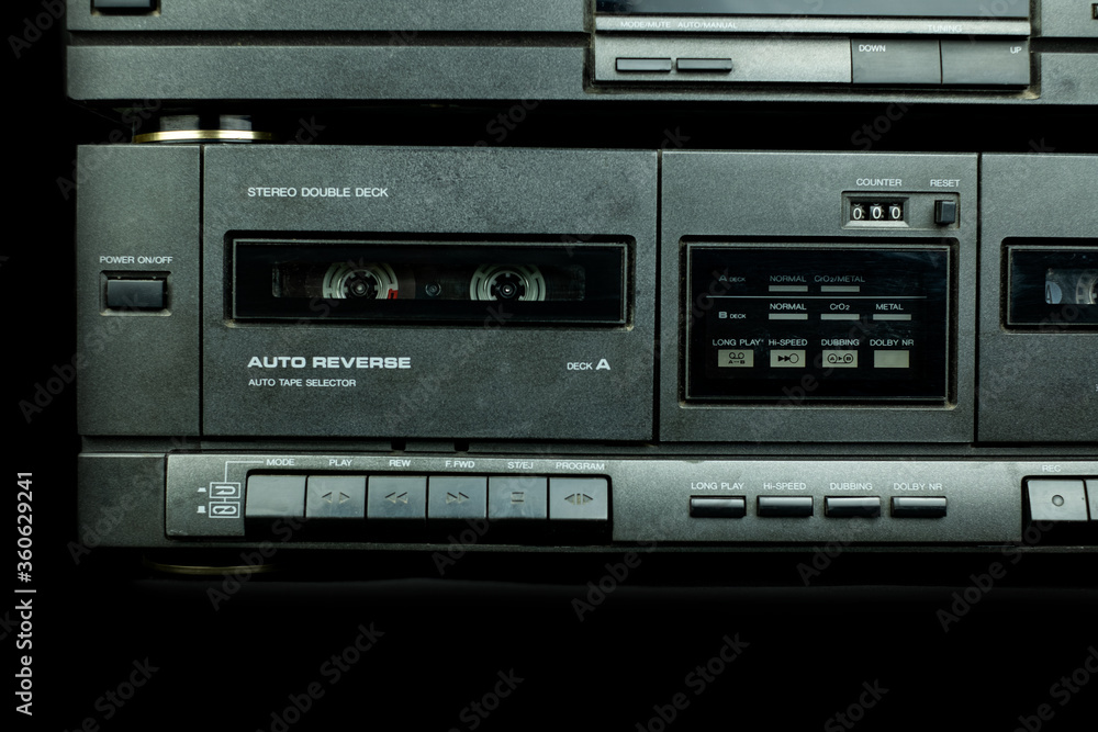 Close up front a deck recorder of the vintage stereo cassette tape player with the push operation buttons are retro technology Close up front a deck recorder of the vintage stereo cassette tape player with the push operation buttons are retro technology