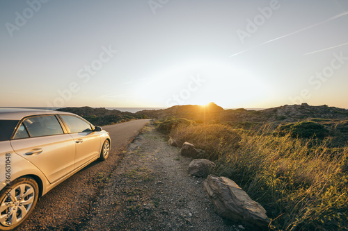 A car parked on the side of a dirt field © Дмитро Григорчак