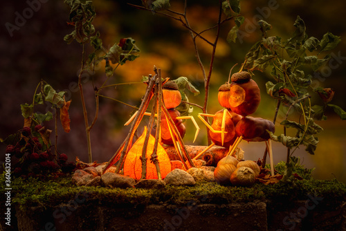 chestnut figure model of people around a fire in the woods