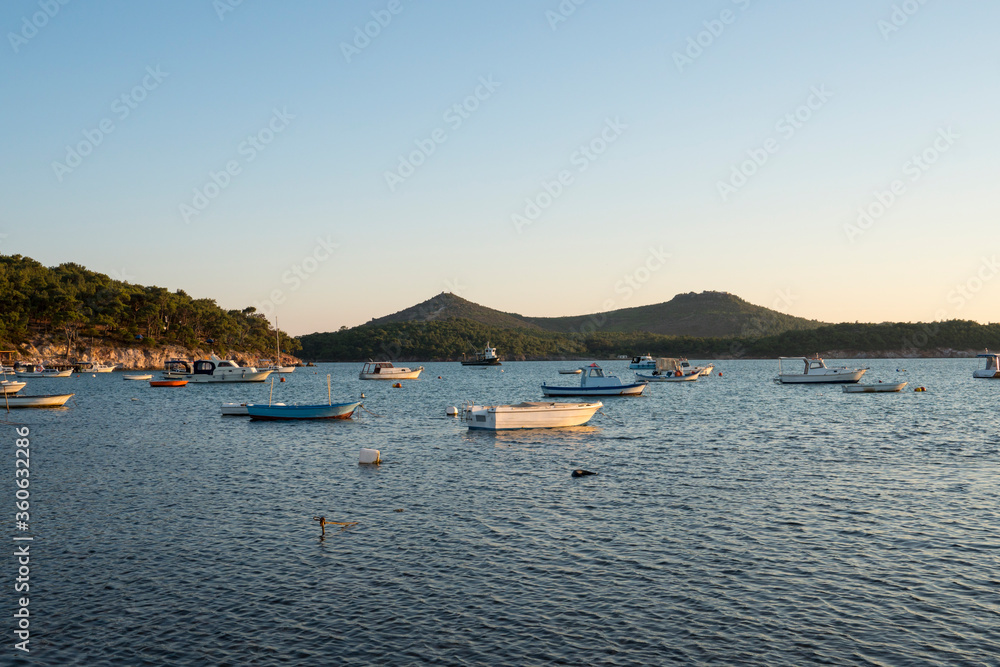 Boats on the sea in hill background