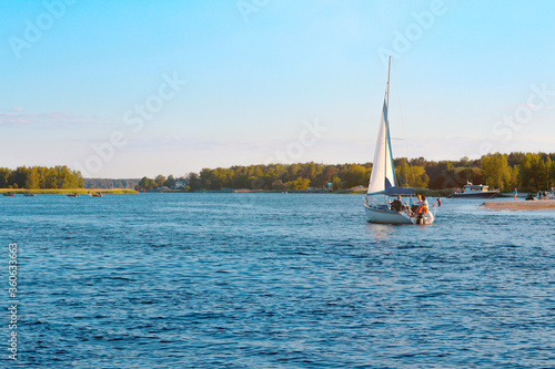 sailboat on the river,family holidays on a yacht, boat trip, landscape © Vitaly
