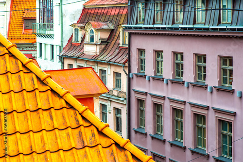 Traditional architecture of Old town of Riga, Latvia. Close-up of red tile roof. Modern exterior. photo