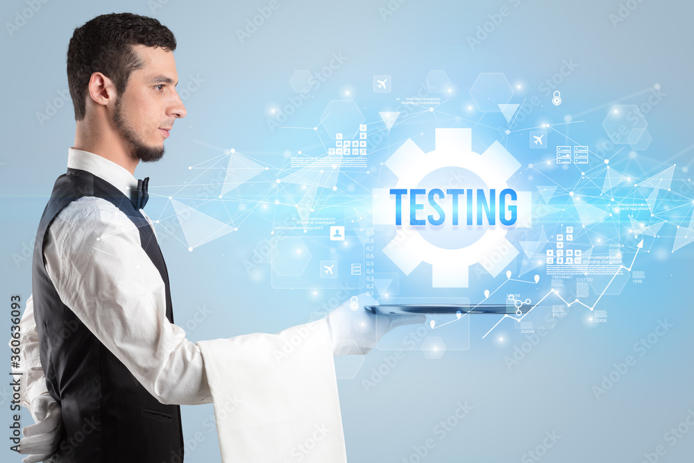 Waiter serving new technology concept with TESTING inscription Waiter serving new technology concept with TESTING inscription