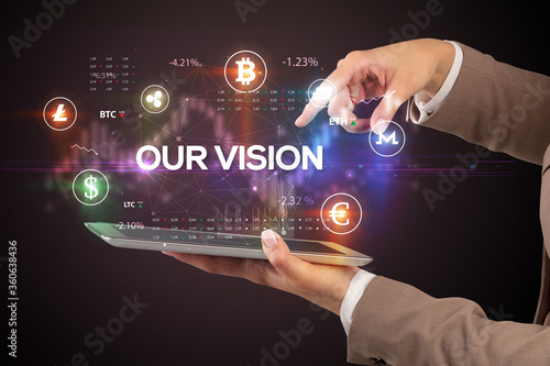 Close-up of a touchscreen with OUR VISION inscription, business opportunity concept