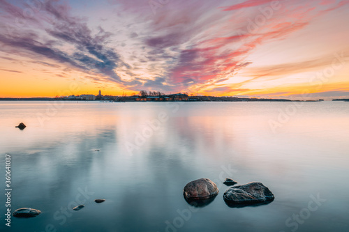 Helsinki, Finland. Panorama Panoramic View Of Suomenlinna Church In Fortress Of Suomenlinna Or Sveaborg And Partially Fortified Island Harakka On Sunrise Sunset Time photo