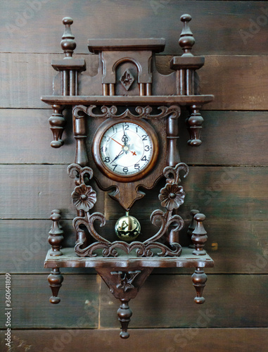 antique clock on wooden background