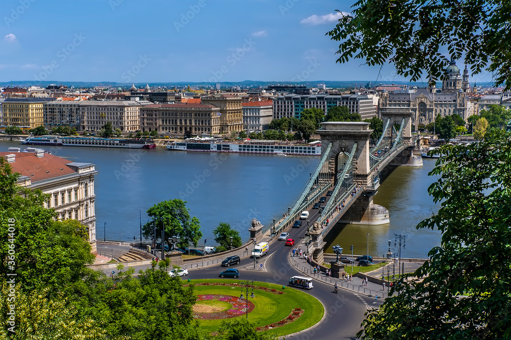 A view across the River Danube and the Chain Bridge towards the northern shore in Budapest in the summertime