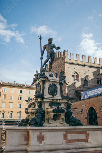 A group of people in front of Fountain of Neptune, Bologna