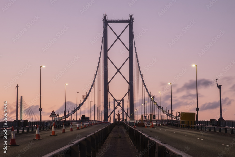 Forth Road Bridge closed for repairs in the evening against the sunset sky. United Kingdom