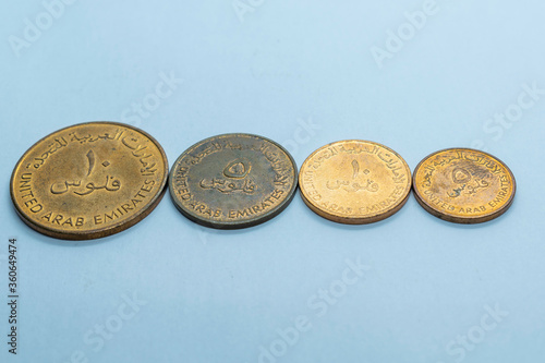 a collection of old emarati copper coins, uae, uniter arab emirates old coins, old currency photo