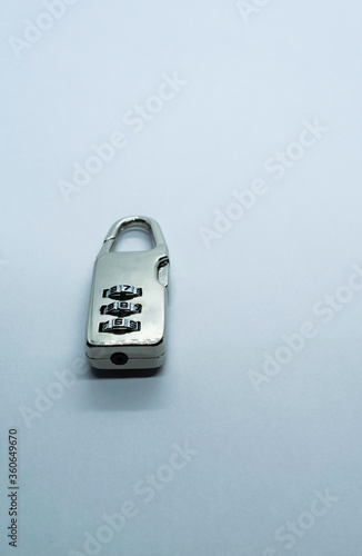 A lock on a plain white background. Selective focus, Selective focus on subject, background blur