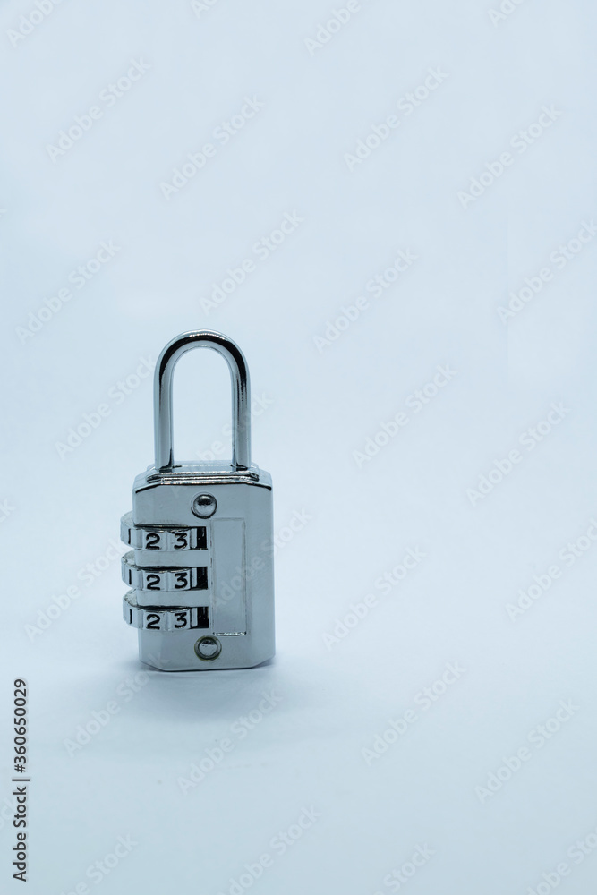 A lock on a plain white background. Selective focus, Selective focus on subject, background blur . A lock on a plain white background. Selective focus, Selective focus on subject, background blur .