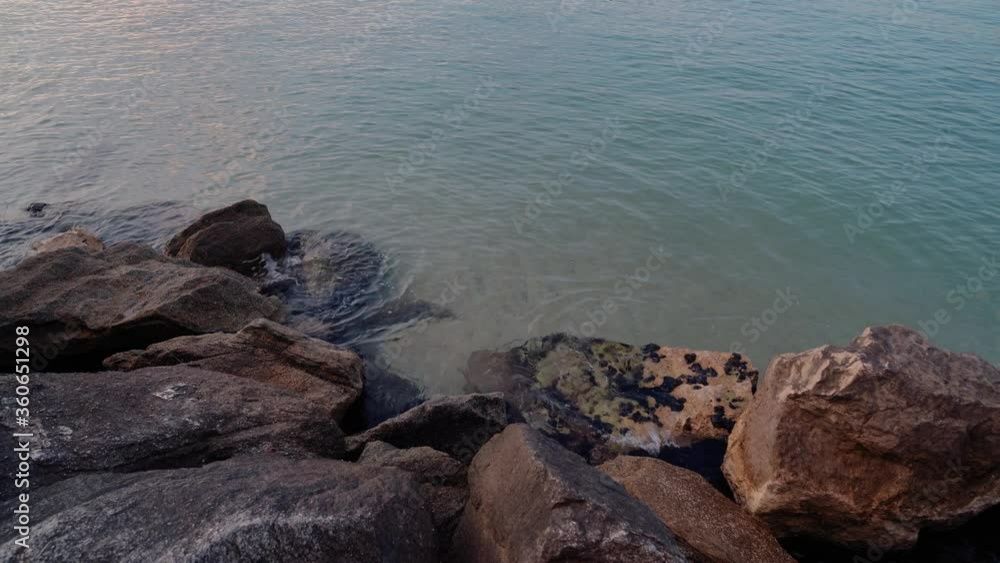 Stock slow motion video of a calm sea with the large rocks of a port. Stock slow motion video of a calm sea with the large rocks of a port.