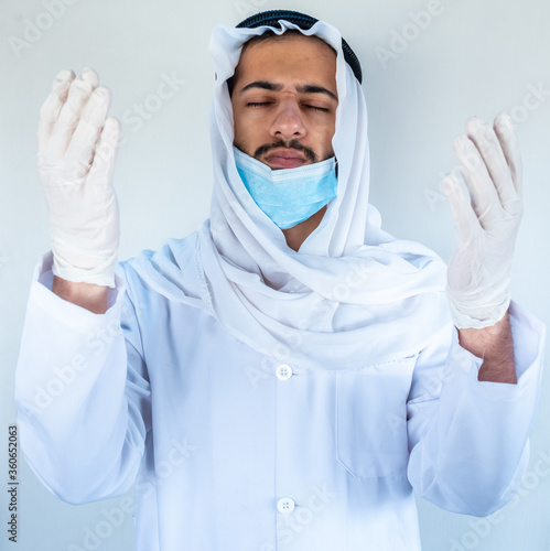Arabic muslim doctor praying for infected people
