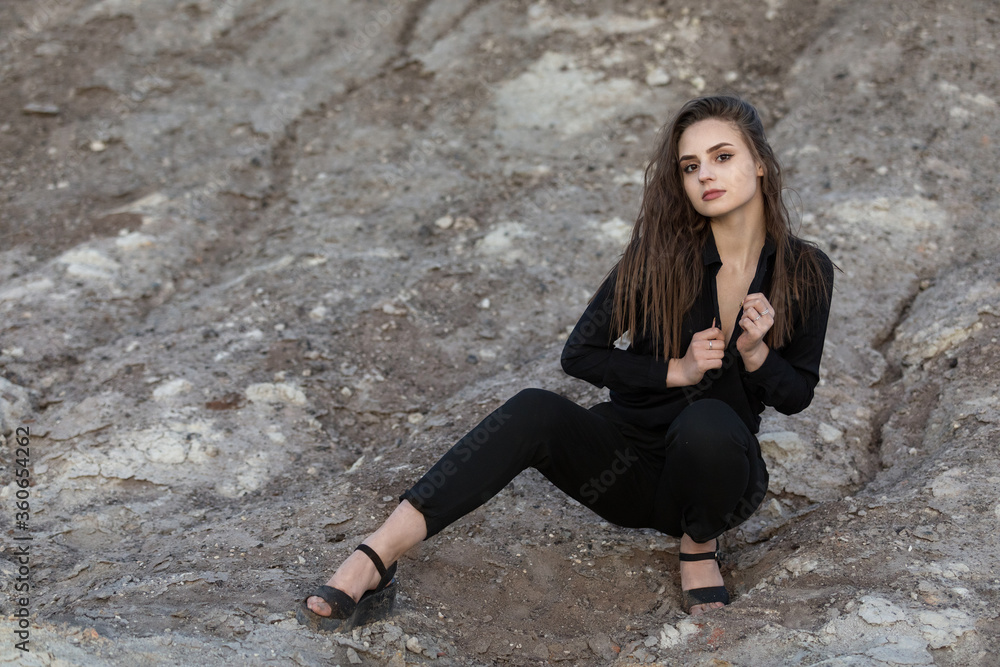 beautiful girl posing among rock formations of a rock. outdoors beautiful girl posing among rock formations of a rock. outdoors