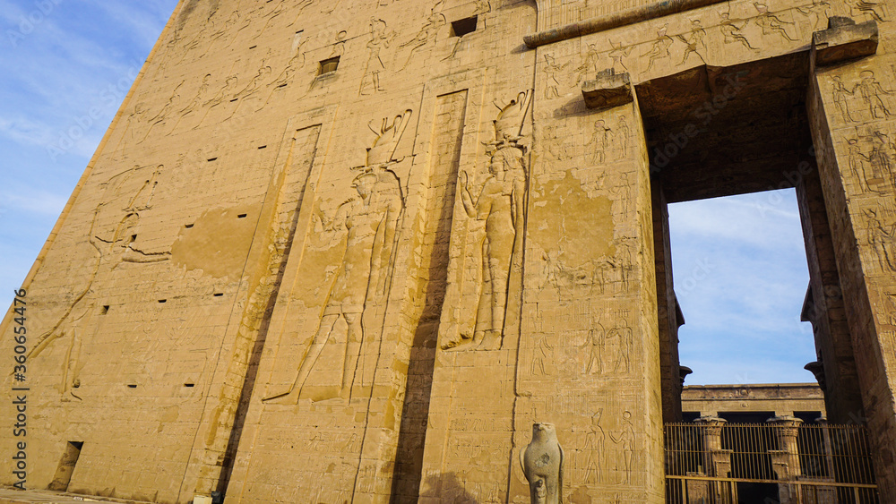 Entrance of Edfu temple of Horus majestic beautiful landmark with ancient blue paint on wall Entrance of Edfu temple of Horus majestic beautiful landmark with ancient blue paint on wall