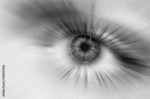 Macro black and white eye. Divergent abstract rays from the pupil of the human eye. Concept of dreams or abstraction, purity or treatment of vision. Macro