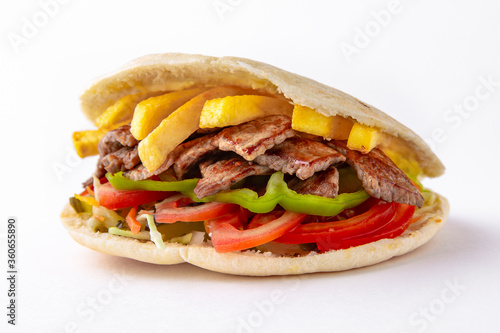 Kebab, pita, gyros, shaurma, wrap sandwich. Street food. Takeaway food.