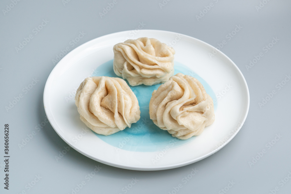 Traditional Chinese food, salt and pepper salt hanamaki. Chinese food Hanamaki on the plate. 