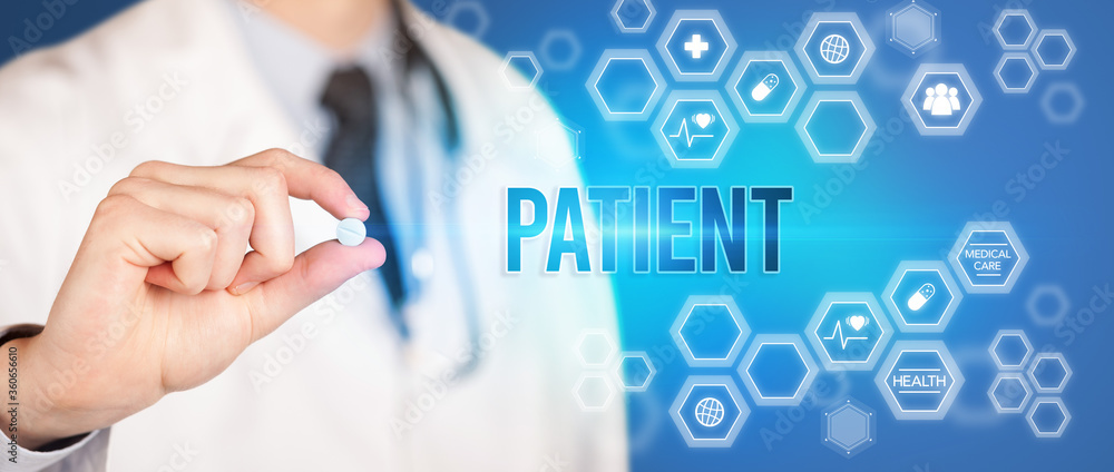 Close-up of a doctor giving you a pill with PATIENT inscription, medical concept Close-up of a doctor giving you a pill with PATIENT inscription, medical concept
