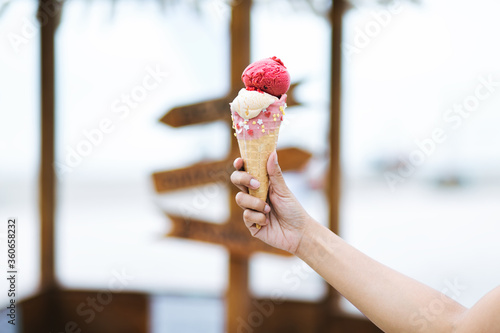 Mix berry and vanilla ice cream cone on hand