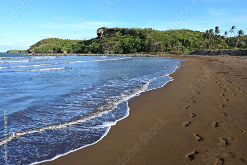 The Black Sand Beach of Talofofo bay on Guam.