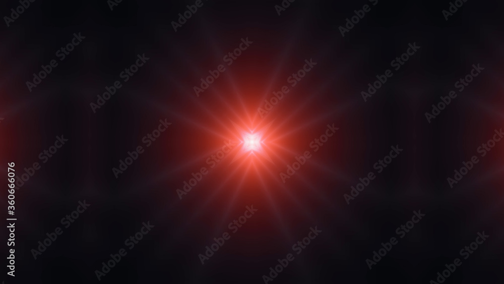 Beautiful lens flare with rays on a black background.