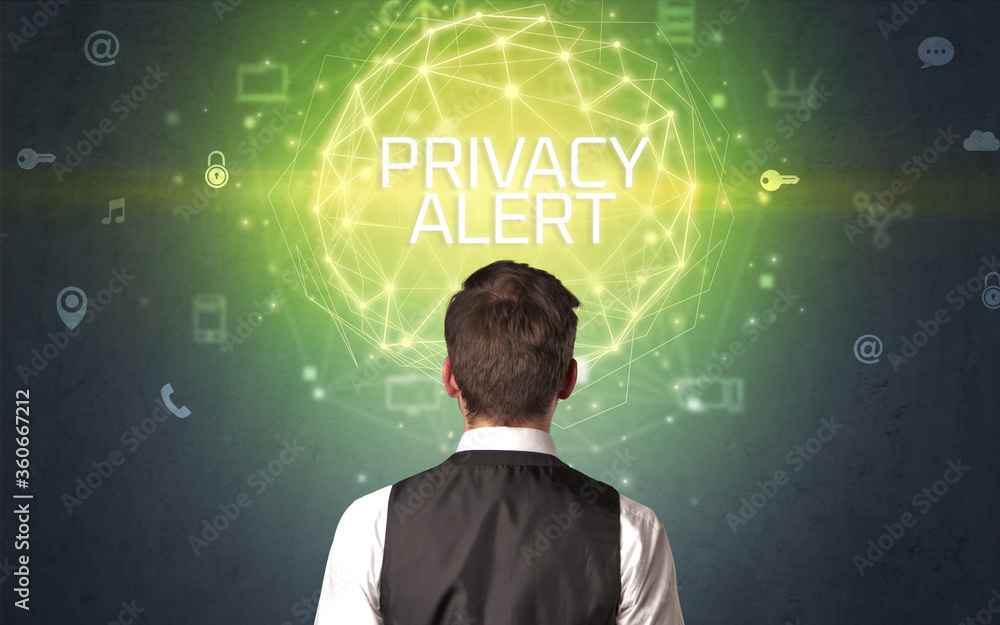 Rear view of a businessman with PRIVACY ALERT inscription, online security concept Rear view of a businessman with PRIVACY ALERT inscription, online security concept