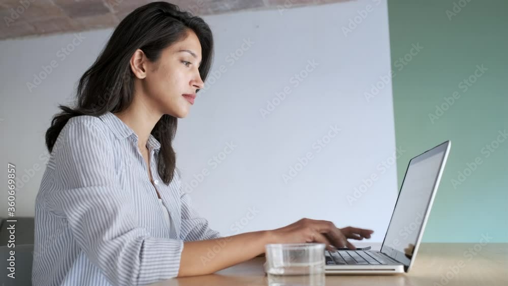 Video of elegant young business woman working with her laptop in the ...