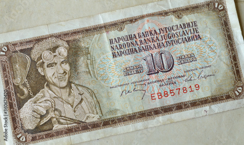 Obverse of 10 dinar paper banknote issued by Yugolavia that shows portrait of a miner photo