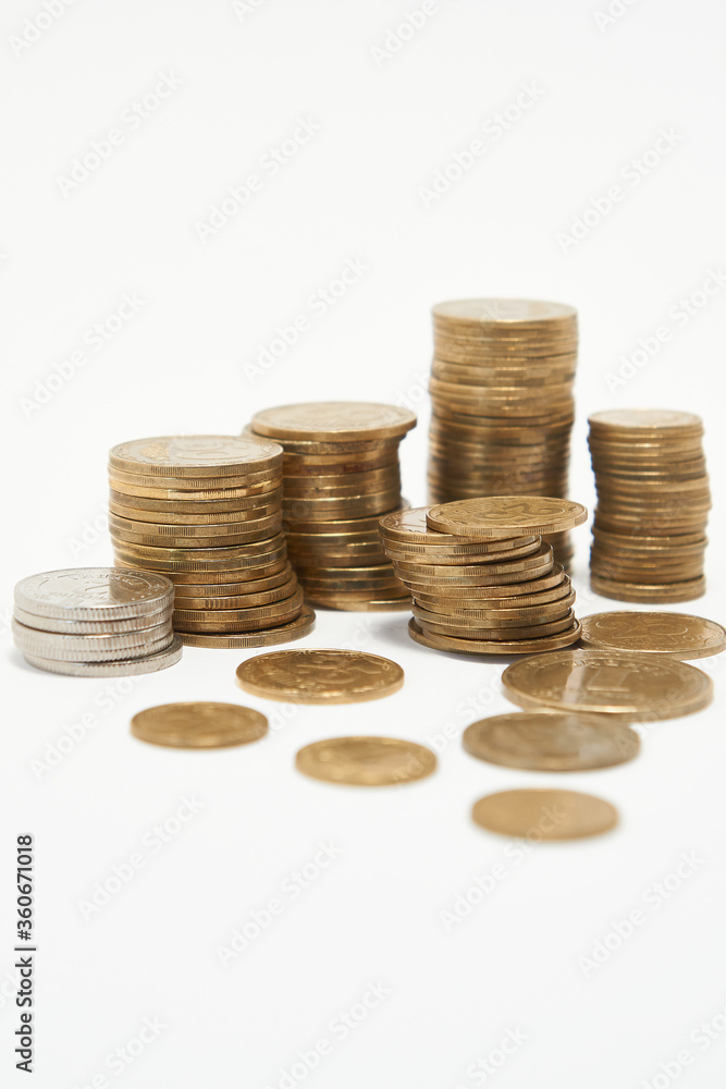 Stacks of coins on a white background. Stacks of coins on a white background.