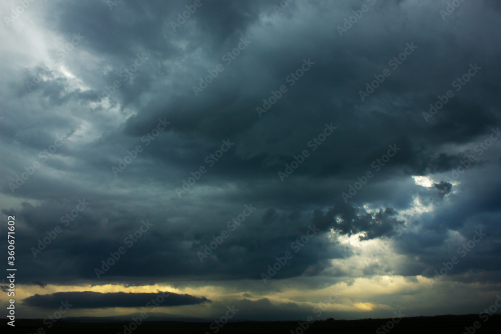 Dark sky and a sharp black cloud before the rain. Dark sky and a sharp black cloud before the rain.