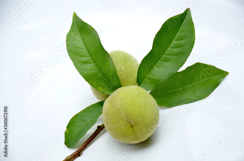 Wallpaper Mural the ripe peach with green leaves isolated on white background. Torontodigital.ca