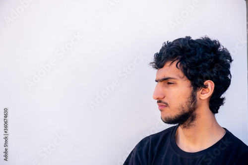 Arabic muslim mna standing to cut his hair © Diya