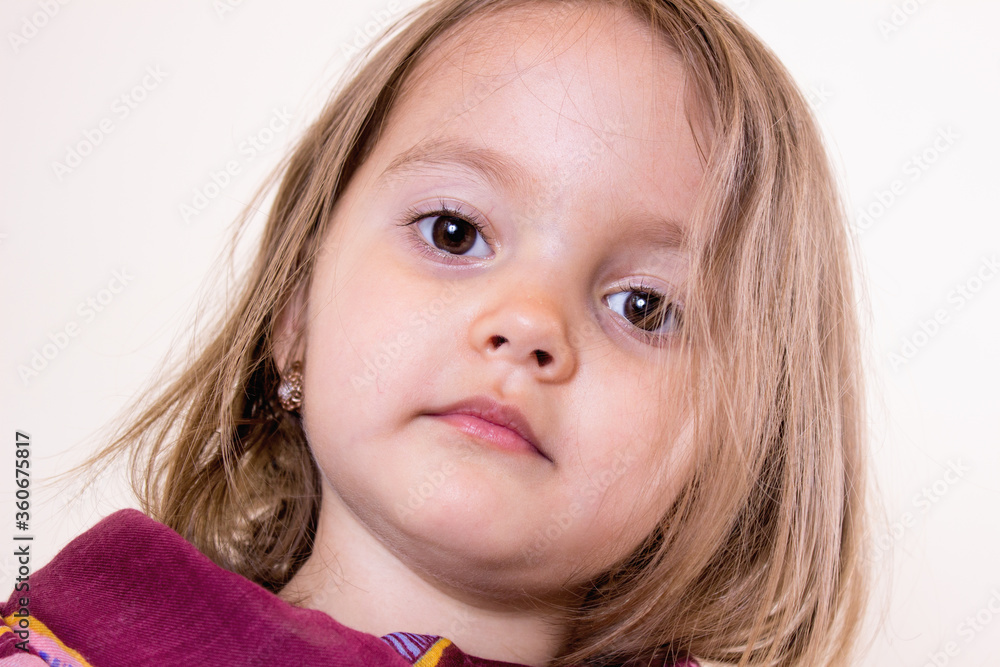 Beautiful little girl with painted lips and lipstick Beautiful little girl with painted lips and lipstick